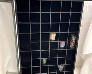 Shot glass/golf ball display case