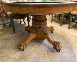 Beautiful round glass top footed pedestal table