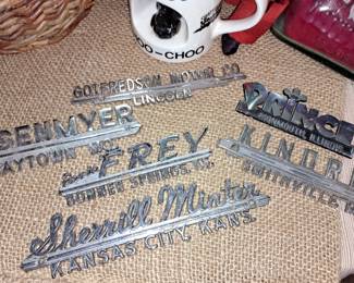 Vintage metal car dealership emblems 
