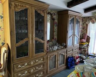 House pic DR Thomasville furniture. It has two hutches, one server, two consoles, a table with leaves, and eight chairs. It is in like-new condition.