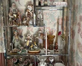 house pic LR curio, Fenton, ceramics, porcelain roses,  cut glass, Santas, Clowns