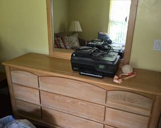 Dresser with mirror and printer.