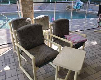 Set of PVC chairs and tables.