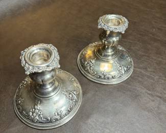 Sterling Silver CandleSticks $150 one is badly damaged on the bottom, so the price for One but you get both.