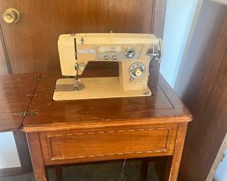 Sewing machine in cabinet