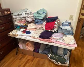 Well, here is a shot of the obligatory estate sale linen table! We have this and a CLOSET filled with terrific sheets sets, singles, towels, washcloths, blankets, quilts, and more!