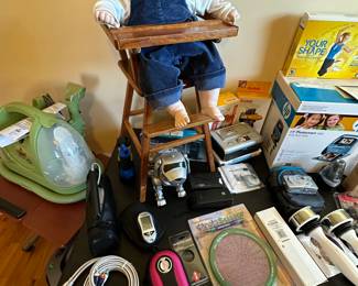 This table is primarily small electronics - TV, Digital Cameras etc...Bissell Green Machine and more!