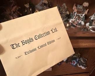 Inside the bookcase is an HUGE collection of Boyd Bear Figurines!