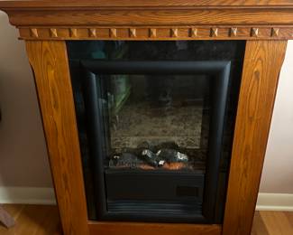 This is a FANTASTIC Oak Electric Fireplace! It looks MINT! Works perfectly! With remote!