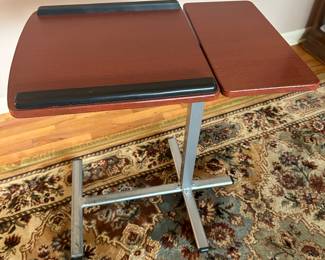 A very useful and practical chair or bed table. Has the ability to move tilt in MULTIPLE directions!