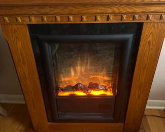 This is a FANTASTIC Oak Electric Fireplace! It looks MINT! Works perfectly! With remote!