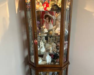A sweet lighted OAK corner curio cabinet! This would be a great display piece for all your small treasures!