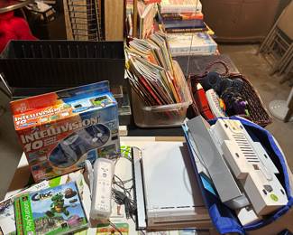 The end of this table is filled with video games! Some hand held systems all the way up to a complete Nintendo Wii systems with games and accessories!