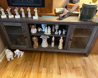 A love this distressed gray TV console! It has shelves and cabinets! In MINT condition!