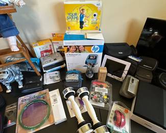 This table is primarily small electronics - TV, Digital Cameras etc...Bissell Green Machine and more!