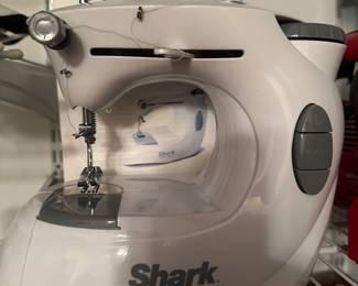 This is a cool little portable SHARK EURO-PRO X sewing machine with accessories!