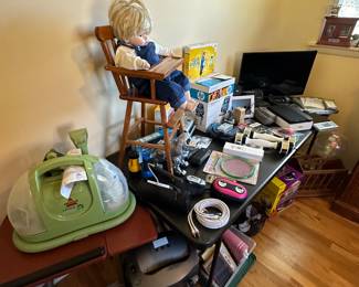 This table is primarily small electronics - TV, Digital Cameras etc...Bissell Green Machine and more!