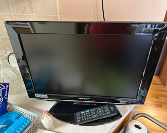 A really nice cute Sharp Flat Screen TV. Complete with remote! This is the perfect size for a kitchen, and that's exactly where we found it!