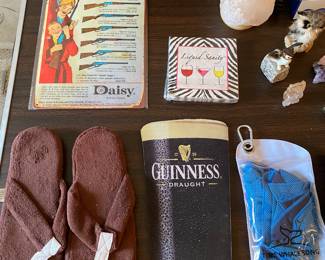 flip flops, Guinnes mouse pad, Daisy advertisement, paper napkins, salt lamp, owl figurines, sewing box, Brother fax machine