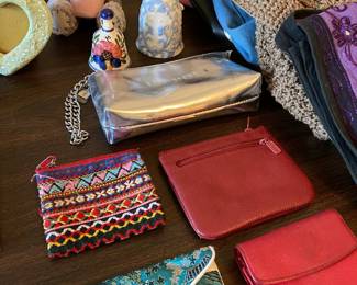 small pouches, wallets, makeup bag, ceramic bells, stuffed animal, purses, handbags, frame, glass vase