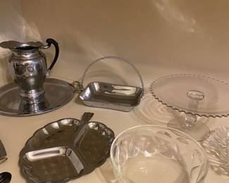 cake plate, glass bowl, divided dish, metal pitcher, platter, metal dish with handle