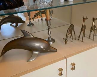 Brass dolphin, brass candlestick, ceramic pig bank