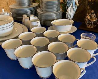 china set, serving tray, Virgin Mary figurine, Jesus painting, La Pieta brass sculpture