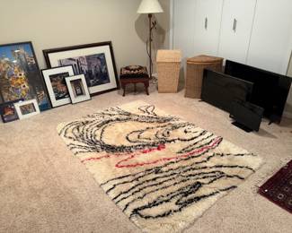 Artwork, Tv's, area rug, floor lamp, baskets