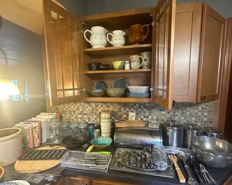 Longaberger Pottery Pitchers; McCoy Brown Pitcher USA;  Pottery; Pottery Wine Bottle Chiller; Pottery Dip & chip bowls; pottery dip chiller;  Turkey Platters; Knives; Flatware; Pampered Chef Pizza Stone and Rack; Glass Canisters; Silver Metal Canisters; Brabantia Roll Top  Metal Bread Box;  Wagner Ware Sidney -0- 1053D Skillet; Cast Iron Skillet USA No.7 10-1/4 in; Cast Iron Corn Muffin Mold; Silver Trays; IHI made in India Pewter Salad Bowls; Tin Cups