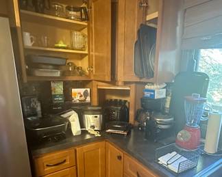 Metal Bakeware; Cookie Sheets; Pyrex Measuring Cup; Ambiano Deep Fryer; Mini Waffle Maker; Rival Hand Mixer; Full Auto Vacuum Sealer; Electric Knife; GE Electric Skillet; T-Fall 4 Slice Toaster; Hamilton Beach Can Opener; George Foreman 2 Serving Grill/ Panini Maker; Mr. Coffee Pot; Bella Kitchen Waffle Maker; Electric Griddle; Osterizer Blender; Large Metal Covered Roaster; Paper Towel Holder; Napkin Holder; Cutting Boards