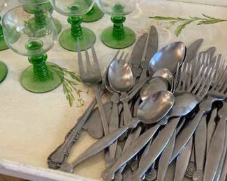 Carly Hall Silverware And Eight Green Stemmed Wine Glasses.