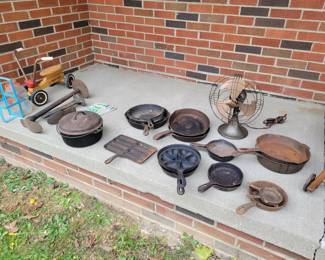 Cast iron pots and pans. A great GE antique fan.