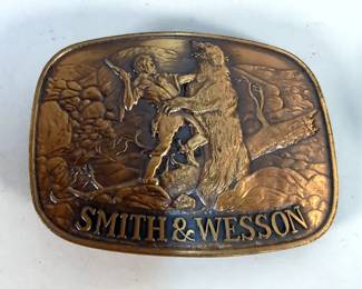 Colt And Smith & Wesson Brass Belt Buckles, Winchester And Hodgdon Caps, And Bullet Key Chains