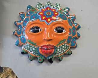 large terra cotta sun decor