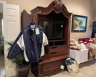 Cherry entertainment/linen storage cabinet, Samsung TV 43", NFL Pro Dallas Cowboys Jacket