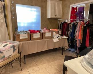 In the Master Bathroom you will find baby and toddler clothing from newborn to 2 and 3T, designer ladies clothes, wonderful evening dresses