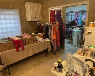 Lots of nice clothes in the master bath and walk in closet