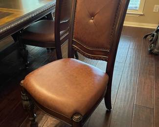 The other dining chairs do not have arms