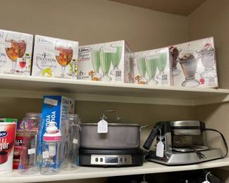 In the pantry Libbey fountain glasses new in boxes, electric Dutch oven, Prof Commercial waffle maker