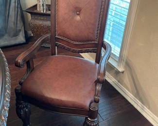 One of the seven dining chairs with arms