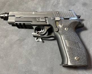 Flip Side / the anchor signifies official side arm of the Navy Seals