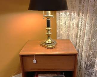 Here is a side table with a drawer (it could be a nightstand, if you want), supporting the table lamp.