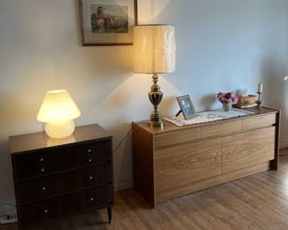 Here you can see lamps, two dressers (or cabinets), and one of the framed paintings.
