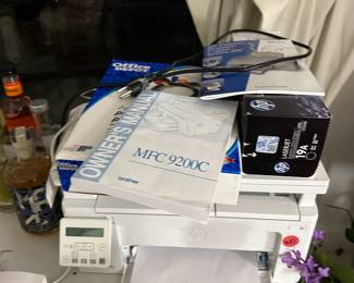 Several printers, ink packs, paper, and more