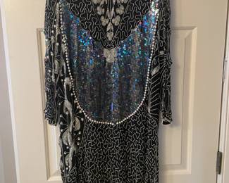 Gorgeous Vintage Womens Clothing from fine evening gowns to sweaters to pants to suits to jackets to denims to leather and more!!! also Boots, Shoes,, Sandals, Purses, Hats, and much much more!!!