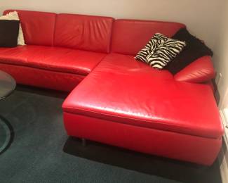 CLOSE UP OF RED LEATHER SECTIONAL