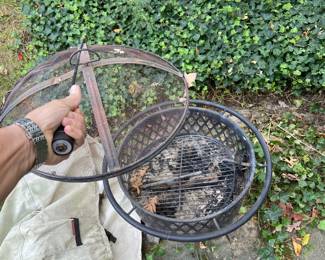Very nice little firepit. Includes cover, sand to use it (required) and a little grilling accessory (pretty sweet...I've rocked some excellent wood fired steaks on here!). $50. Will also throw in a set of marshmallow roasting sticks for smores. 
