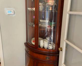One of two corner china buffets. Excellent condition. Three shelves in glass, one drawer, two shelves underneath. This one has locking mechanism on glass section. 6'4" tall and comes out about 2' from the back. This one made by Drexel. $500 each or $800 for the set.  They aren't matching, and aren't close, but they fooled me for 45 years. 