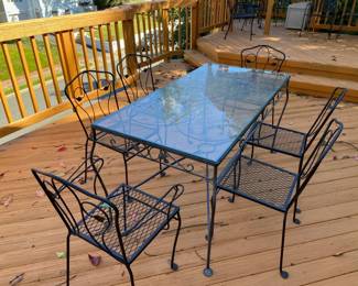 Beautiful, vintage, outdoor wrought iron furniture set. in absolutely excellent condition and so old it has come back into style! Has original glass top and was recently repainted with several coats of rustoleum. Zero imperfections. $1,500. Does have some cushions to go with it. 