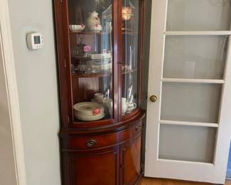 One of two corner china buffets. Excellent condition. Three shelves in glass, one drawer, two shelves underneath. This one 5'11 1/2" tall and comes out about 2' from the back. This one made by Landstrom furniture. Does not have a lock on the glass section. $500 each or $800 for the set.  They aren't matching, and aren't close, but they fooled me for 45 years. 